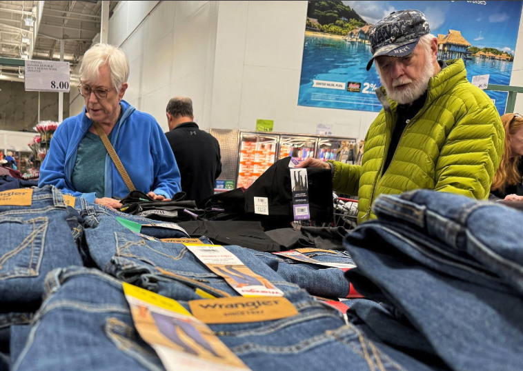 Elderly couple shopping for denim